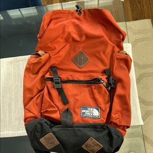 The North Face Red and Black Backpack with Classic Design